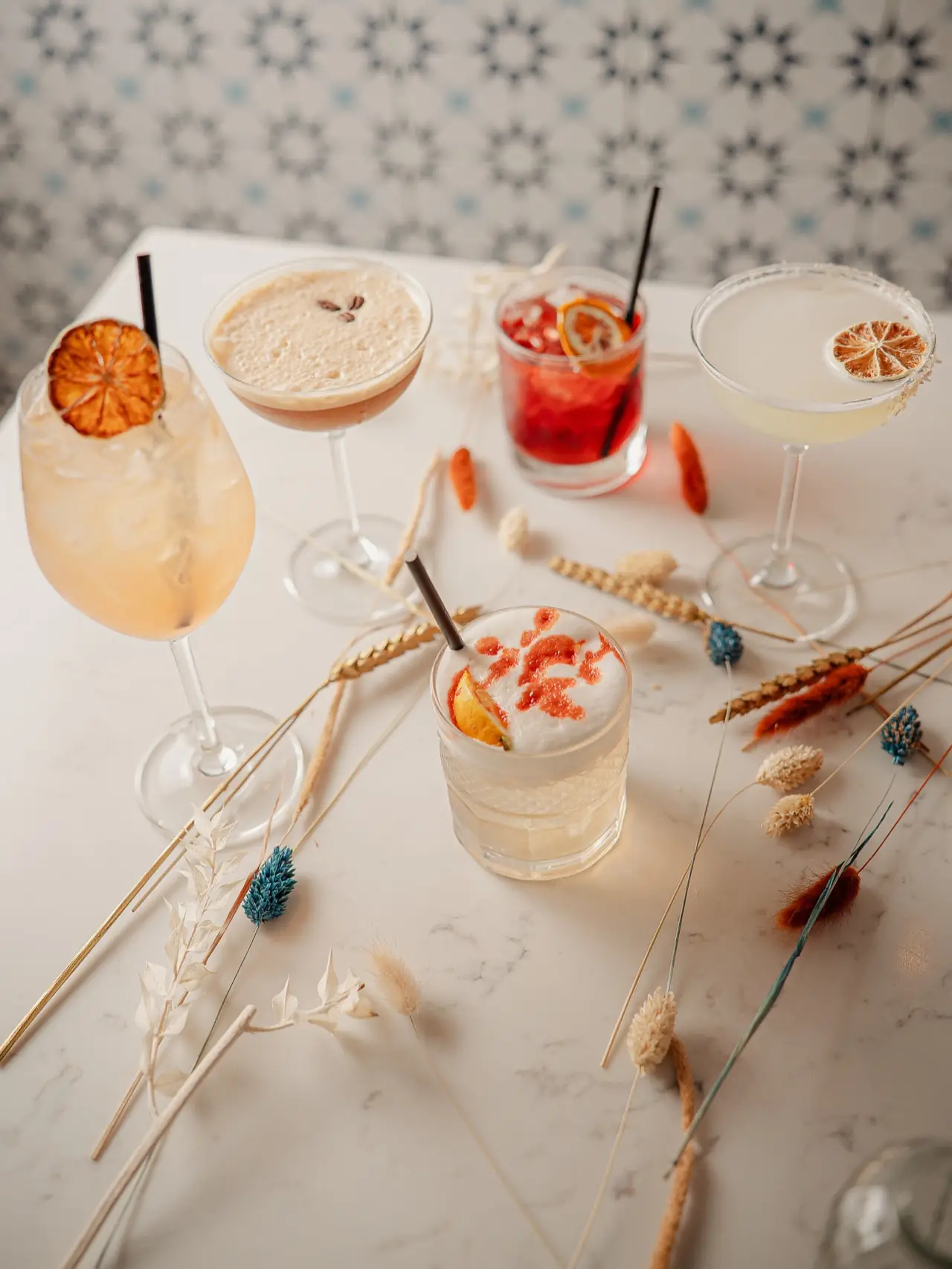Four cocktails together on the marble counter